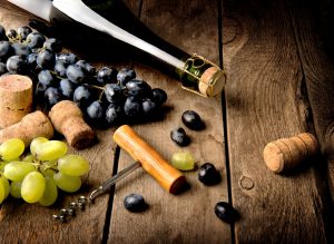 Grape and wine on a wooden table