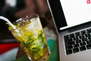 Photo of mojito with a laptop